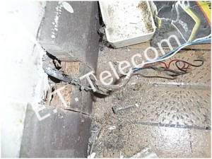 Phone wiring soldered and left to corrode behind the skirting board in an apartment